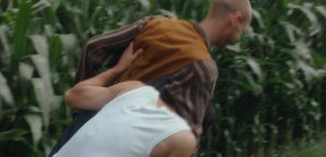 The brothers Don and Sancho are wrestling in a cornfield.